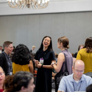 2019 DLF Forum attendees talking and laughing before keynote begins